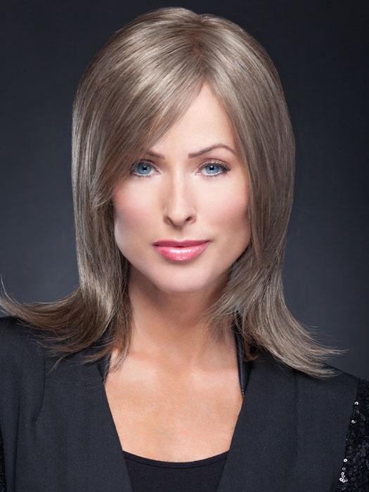Wispy bangs and youthful, smooth, light layers that fall gently to the shoulder
