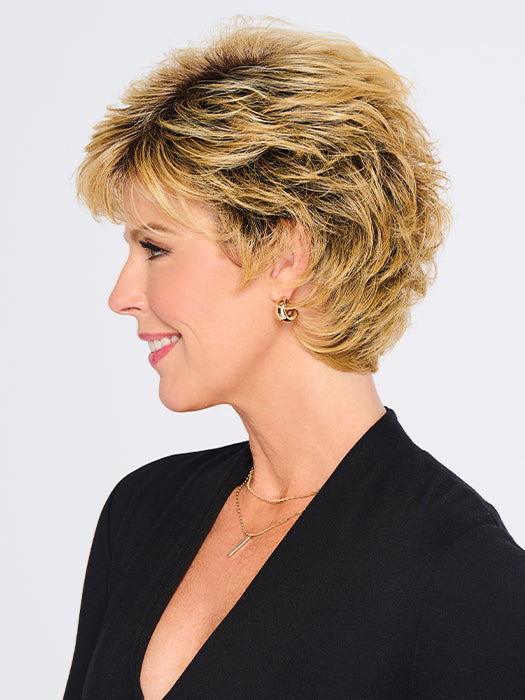 A short shag hairstyle with razor-cut layers and voluminous waves