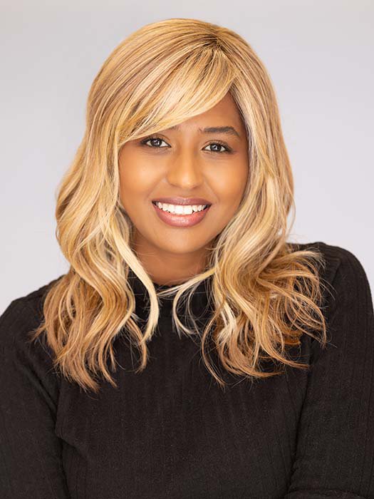 Sophia wearing Beach Wave Magic by TressAllure in color 14/26/R10 | Red Blonde with Gold Blonde highlights and Light Brown roots