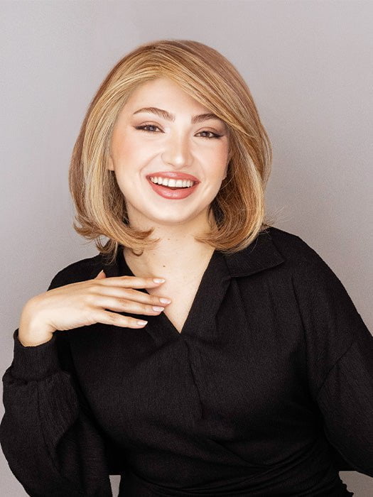Maha is wearing the UPSTAGE LARGE by RAQUEL WELCH in color RL29/25 GOLDEN RUSSET | Ginger Blonde Evenly Blended with Medium Golden Blonde