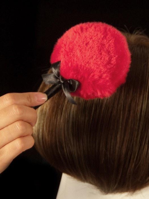 The Wig Wand magically eliminates shine from synthetic wigs.