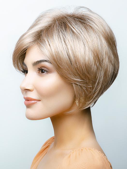 A short, multilayered wig with side swept fringe